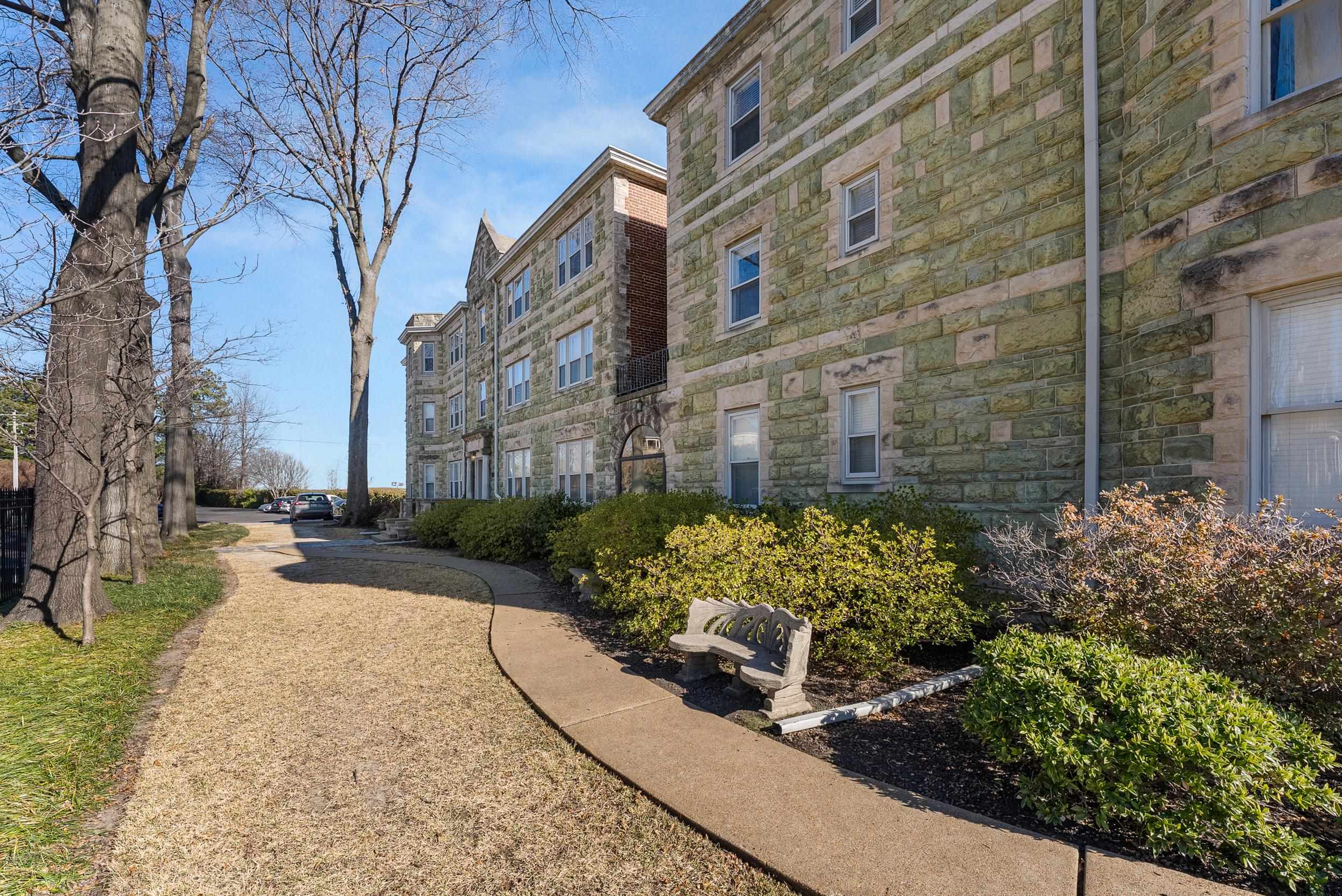 1116 Poplar Avenue, Unit 3 Memphis, TN 38105 - Photo 2 of 25 a view of a pathway both side of house