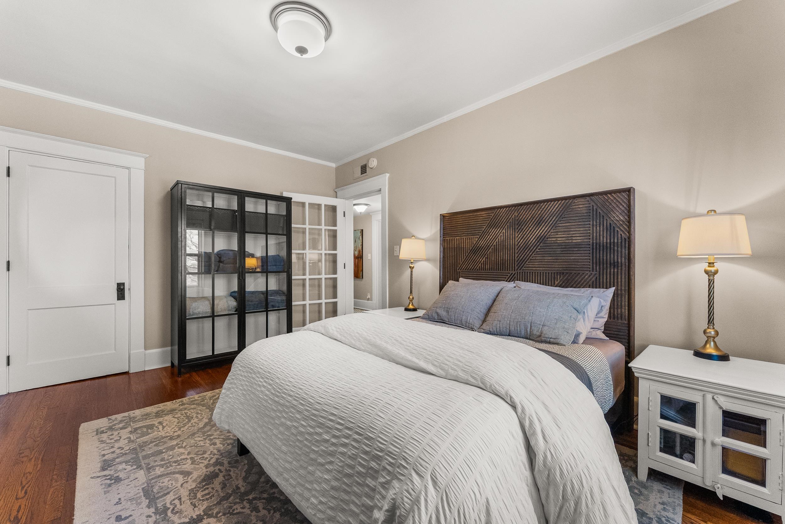1116 Poplar Avenue, Unit 3 Memphis, TN 38105 - Photo 23 of 25 Bedroom featuring dark wood-type flooring and crown molding