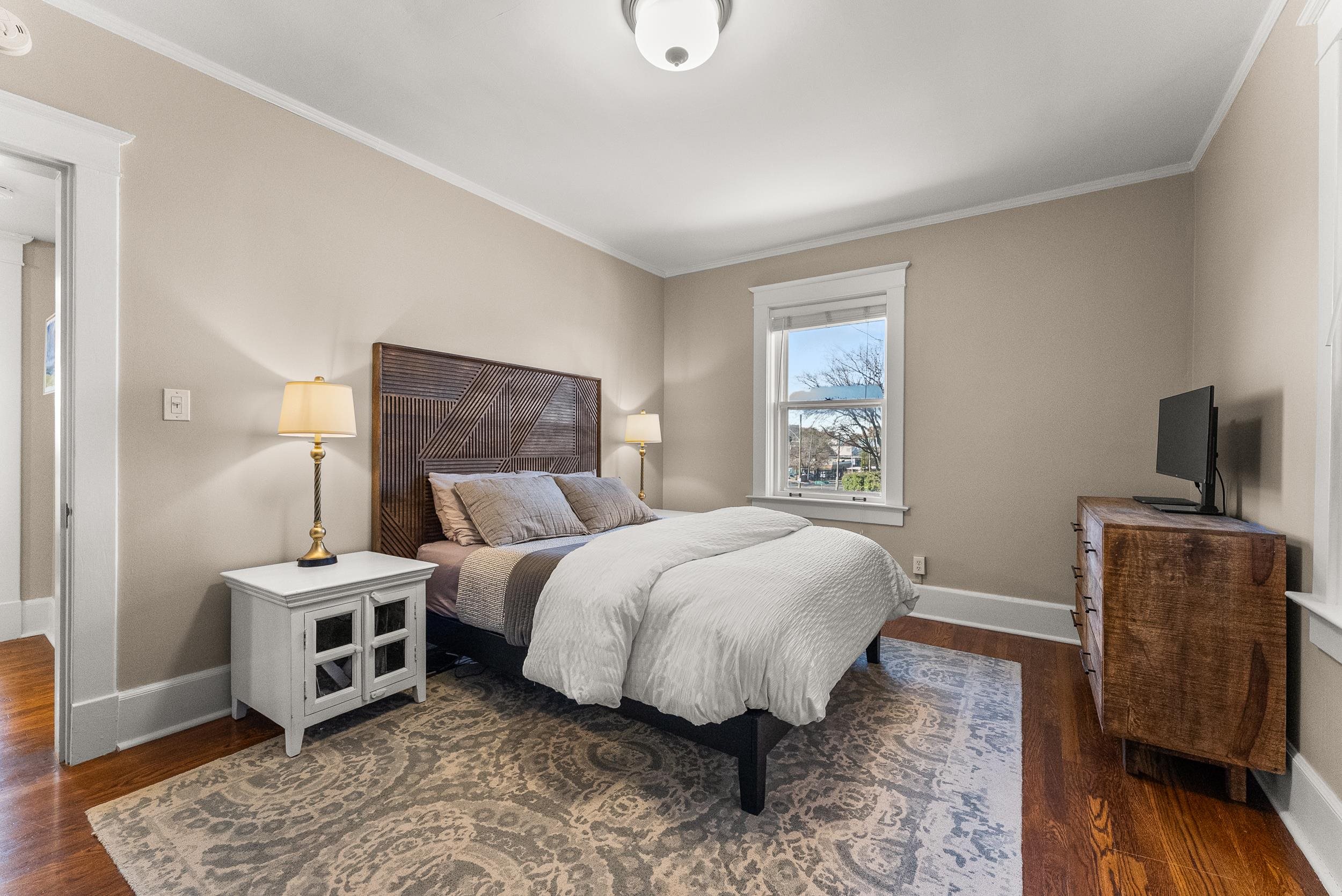 1116 Poplar Avenue, Unit 3 Memphis, TN 38105 - Photo 24 of 25 Bedroom featuring ornamental molding and dark wood-style floors