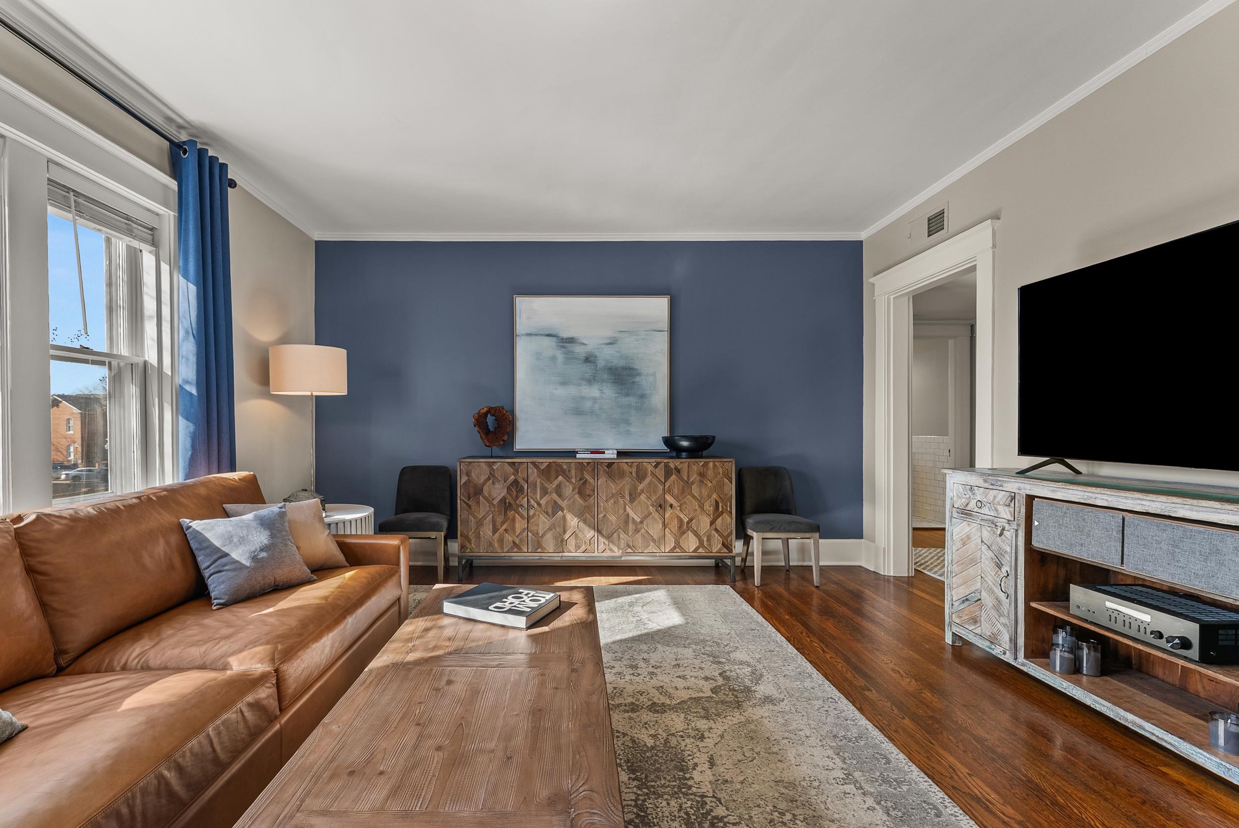 1116 Poplar Avenue, Unit 3 Memphis, TN 38105 - Photo 8 of 25 Living room with dark wood-style flooring and ornamental molding