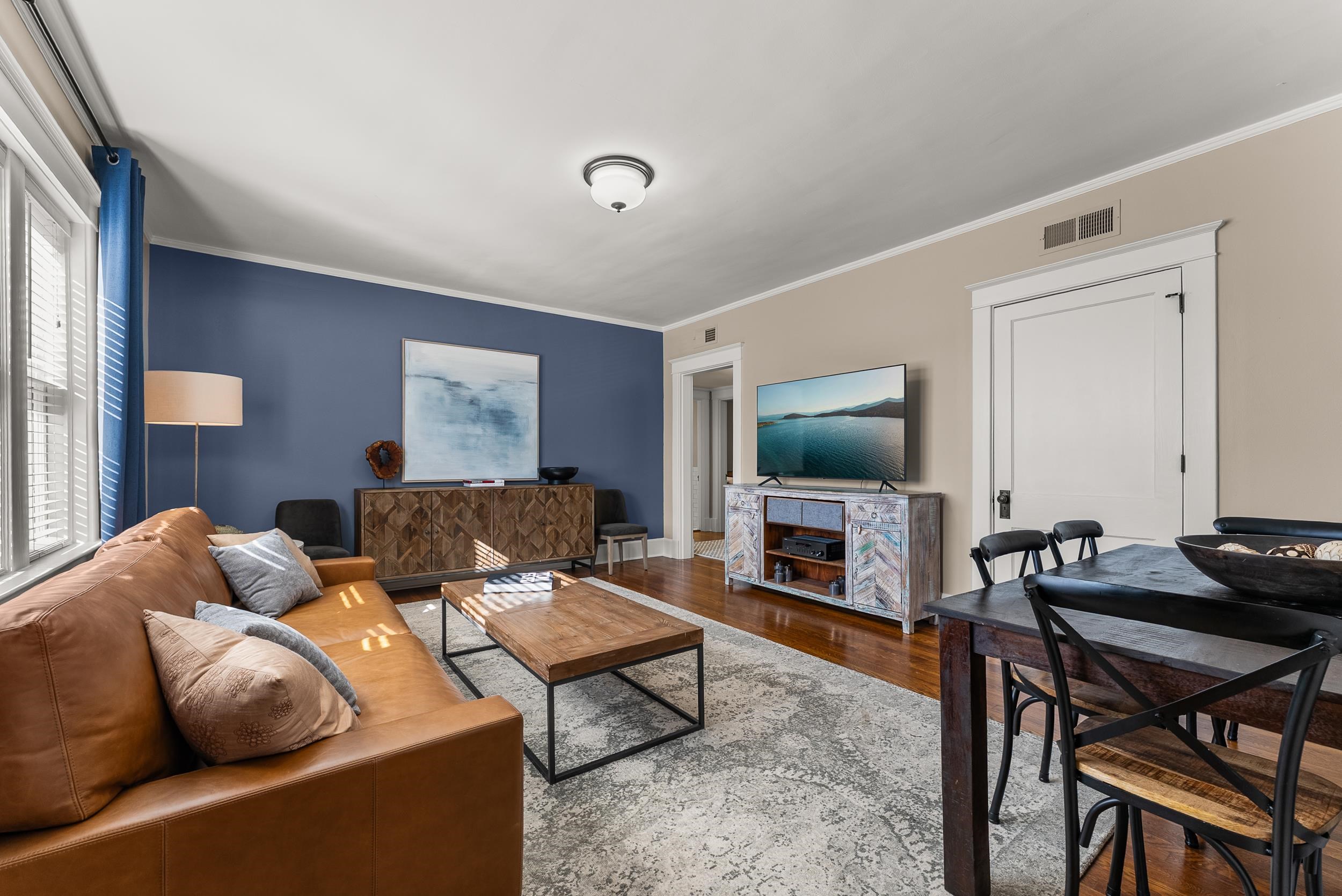 1116 Poplar Avenue, Unit 3 Memphis, TN 38105 - Photo 9 of 25 Living area featuring wood finished floors and ornamental molding
