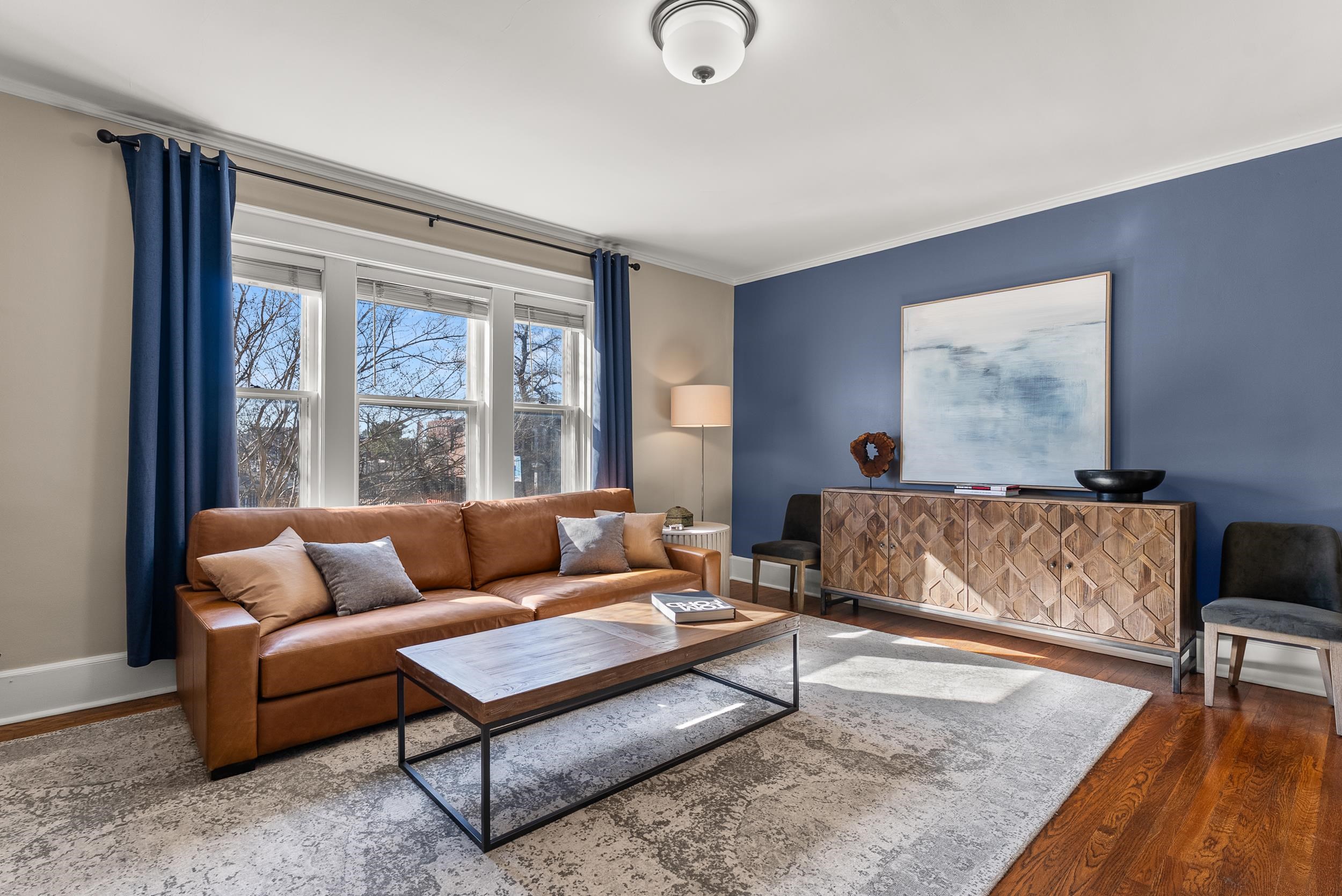 1116 Poplar Avenue, Unit 3 Memphis, TN 38105 - Photo 10 of 25 Living room with crown molding and wood finished floors
