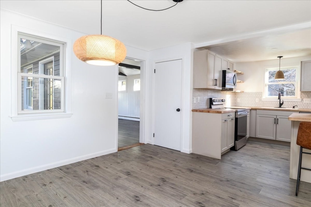 18 Claffey Avenue Worcester, MA 01606 - Photo 11 of 39 a view of a kitchen with wooden floor and a sink