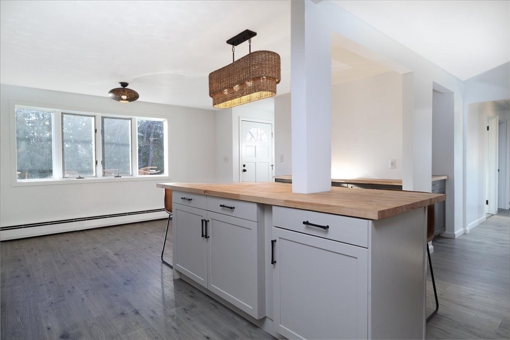 18 Claffey Avenue Worcester, MA 01606 - Photo 18 of 39 a hallway with granite countertop a stove and a sink