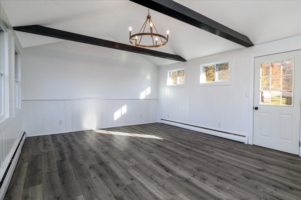 18 Claffey Avenue Worcester, MA 01606 - Photo 19 of 39 a view of an empty room with wooden floor and a window