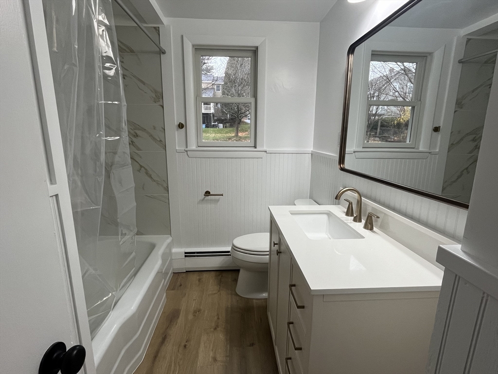 18 Claffey Avenue Worcester, MA 01606 - Photo 30 of 39 a bathroom with a sink a toilet and shower