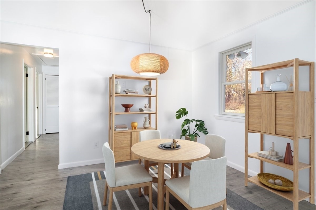 18 Claffey Avenue Worcester, MA 01606 - Photo 9 of 39 a view of a dining room with furniture and wooden floor