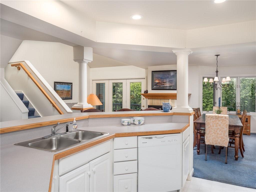 108 Locke Village Road, Unit J3 Newry, ME 04261 - Photo 8 of 32 The kitchen area looks on to the...