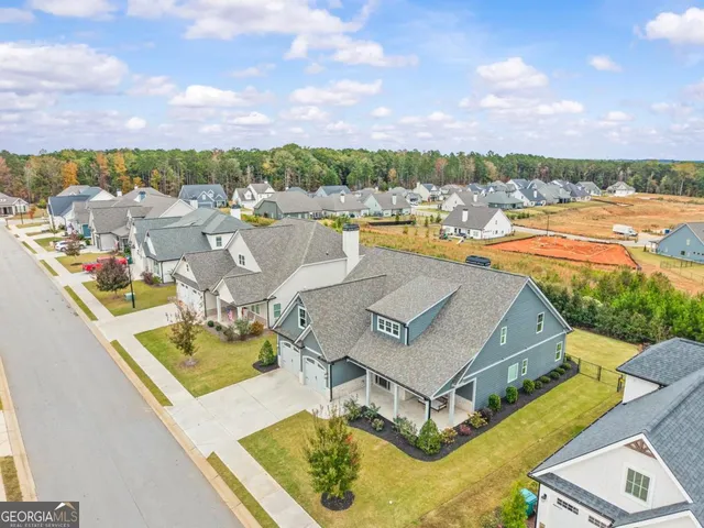 an aerial view of a house with outdoor space