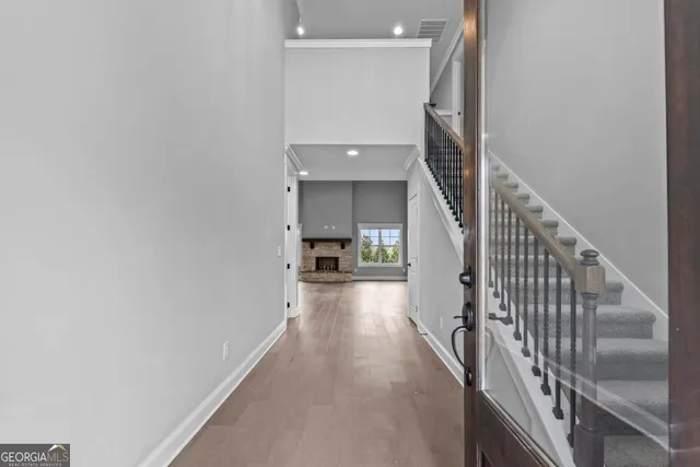 a view of a hallway view with staircase