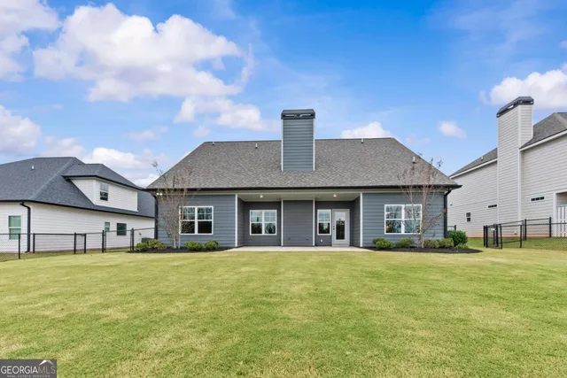 a view of a yard with an outdoor seating