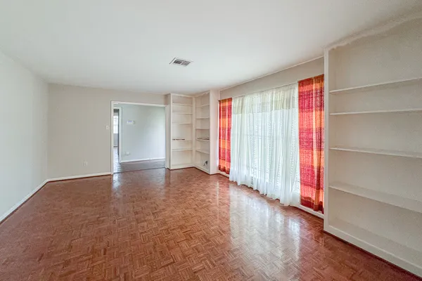 a view of livingroom with hardwood floor and cabinet