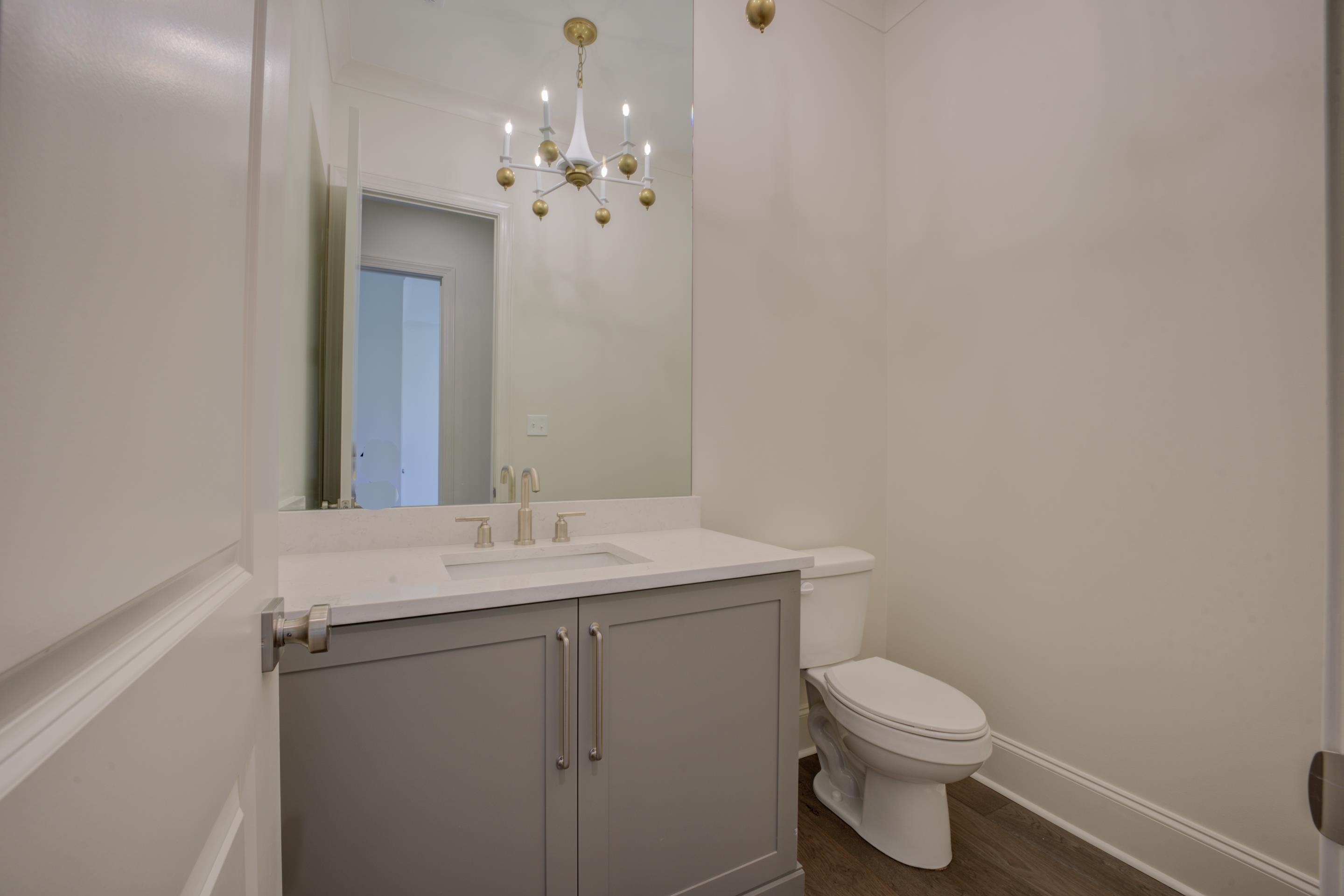 3329 Bailey Station Road Collierville, TN 38017 - Photo 22 of 31 Bathroom featuring toilet, vanity, an inviting chandelier, and hardwood / wood-style flooring