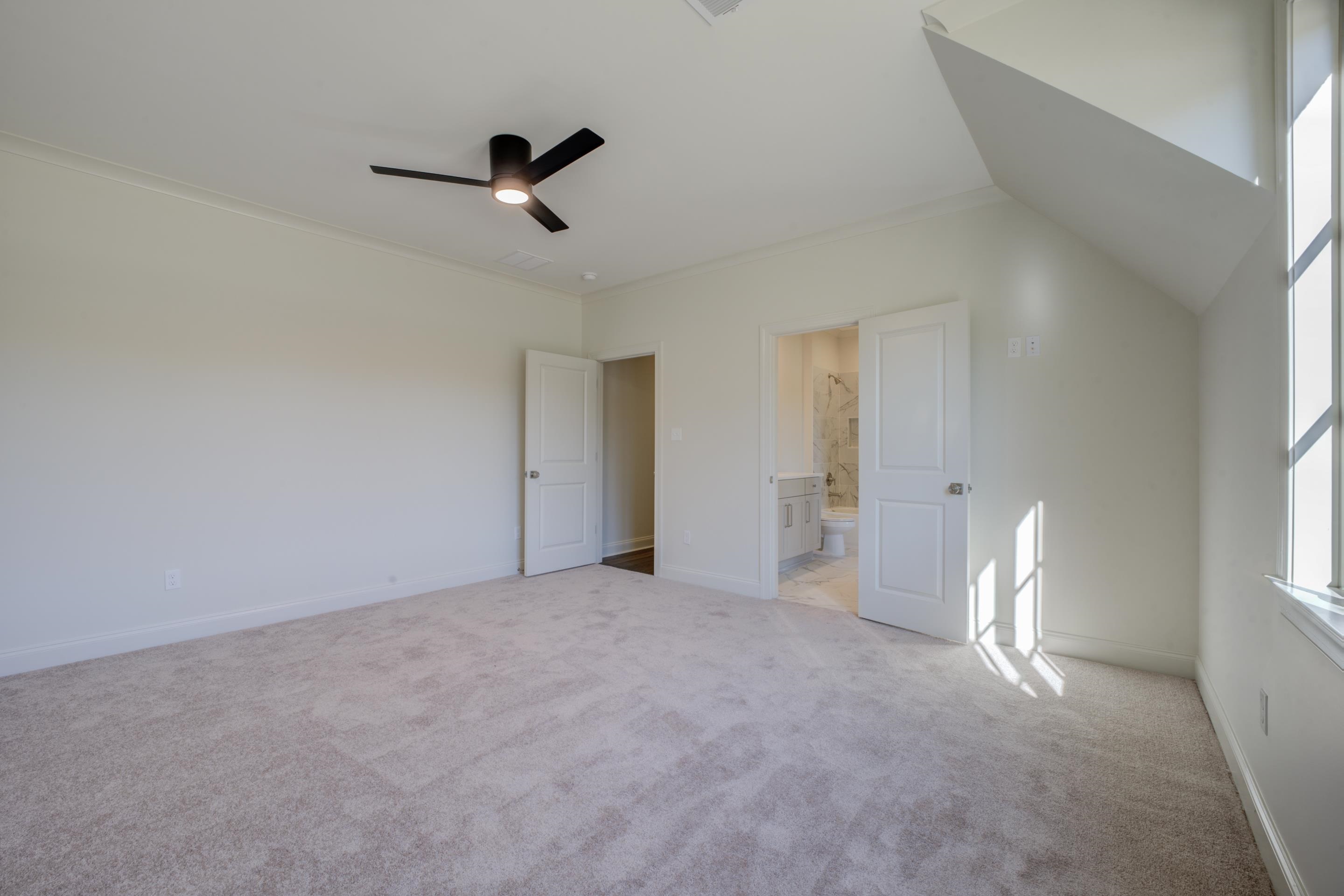 3329 Bailey Station Road Collierville, TN 38017 - Photo 27 of 31 Unfurnished bedroom with ceiling fan, lofted ceiling, light carpet, and connected bathroom