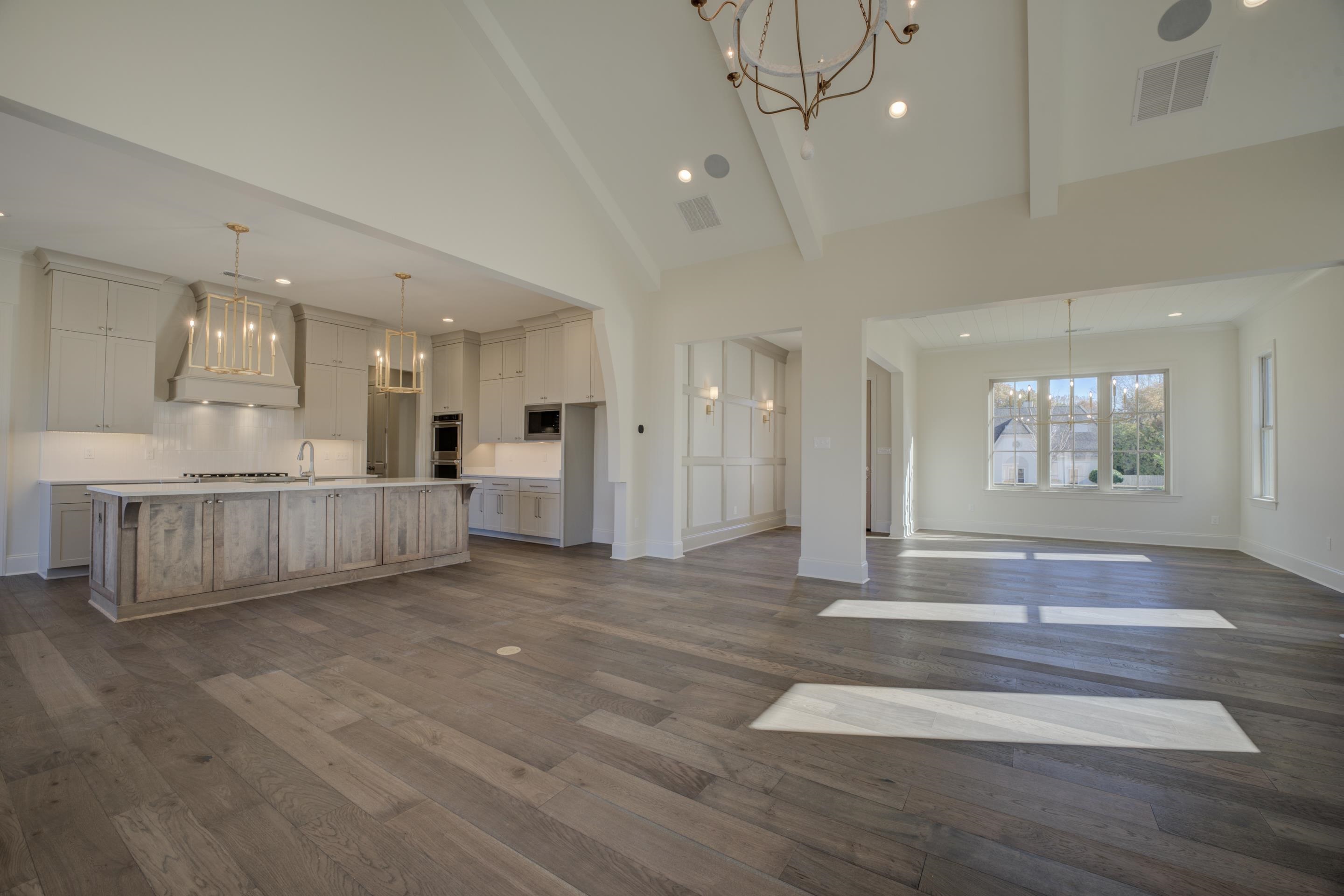 3329 Bailey Station Road Collierville, TN 38017 - Photo 10 of 31 Unfurnished living room featuring beam ceiling, sink, dark wood-type flooring, and high vaulted ceiling