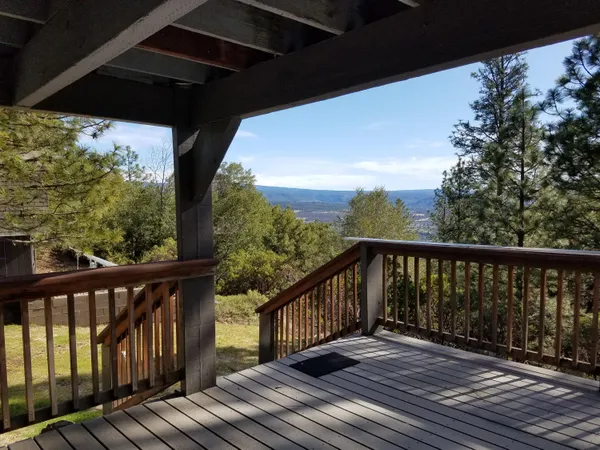 a view of balcony with wooden floor
