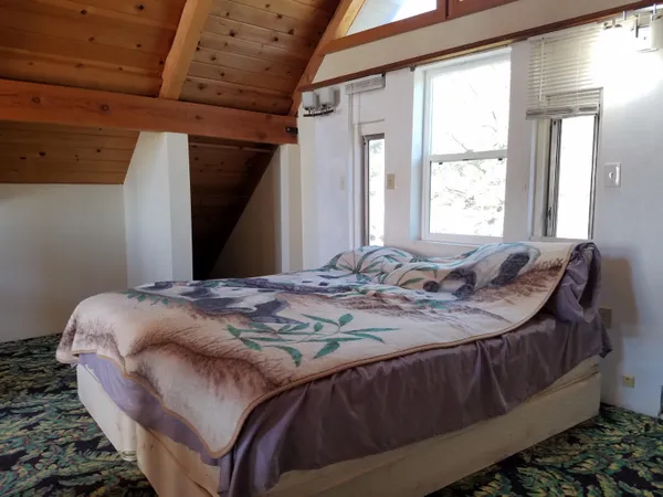a view of a chairs and table in the balcony