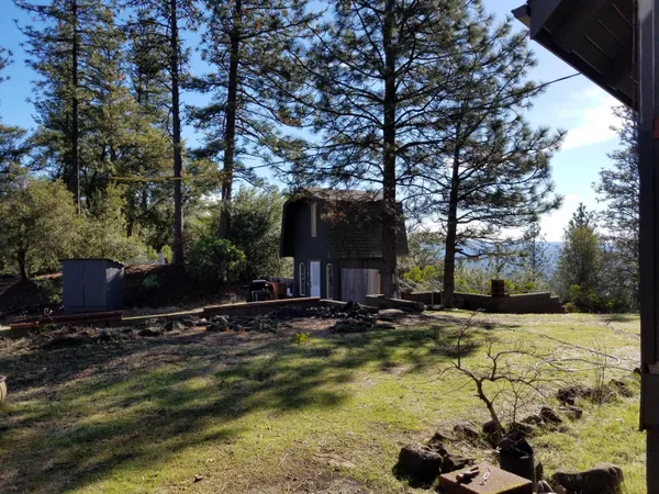 a view of a chair and table in the patio