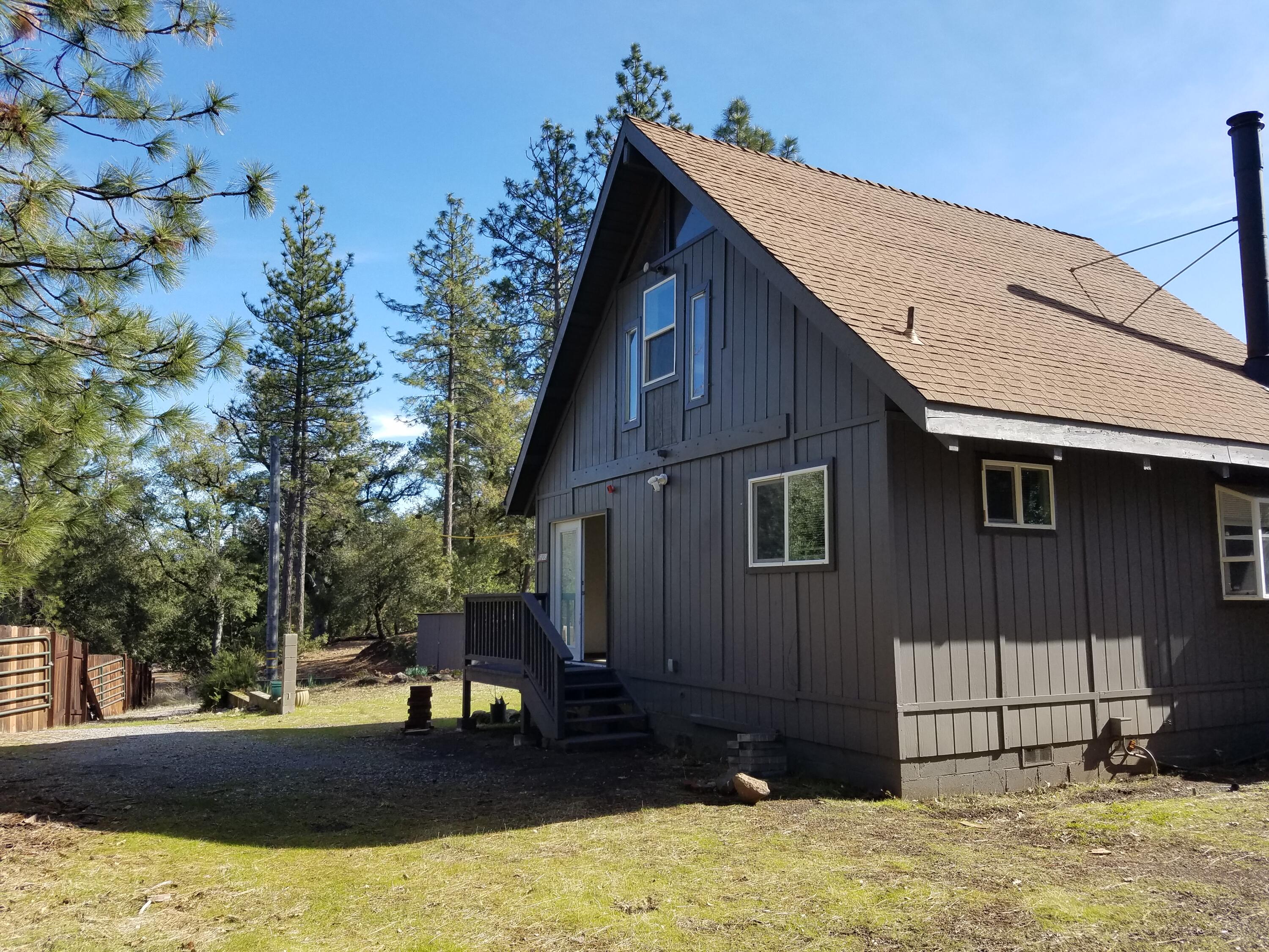 6200 Wilson Hill Road Shingletown, CA 96088 - Photo 5 of 45 a view of a house with a yard