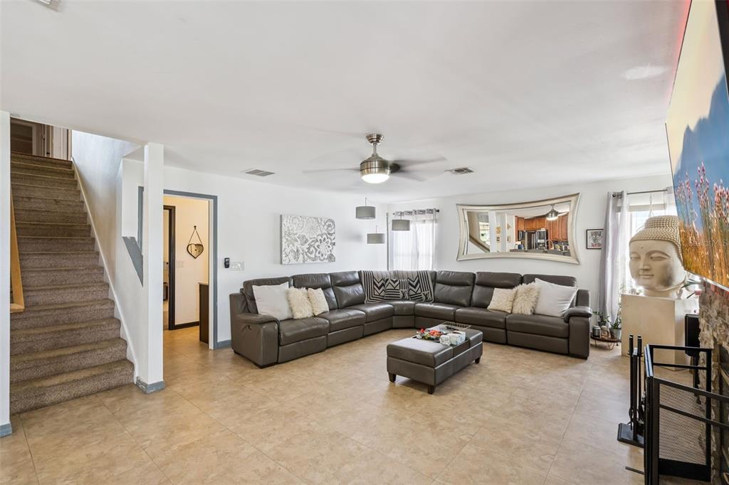 1411 Clarks Summit Court Orlando, FL 32828 - Photo 11 of 50 a living room with furniture and a wooden floor