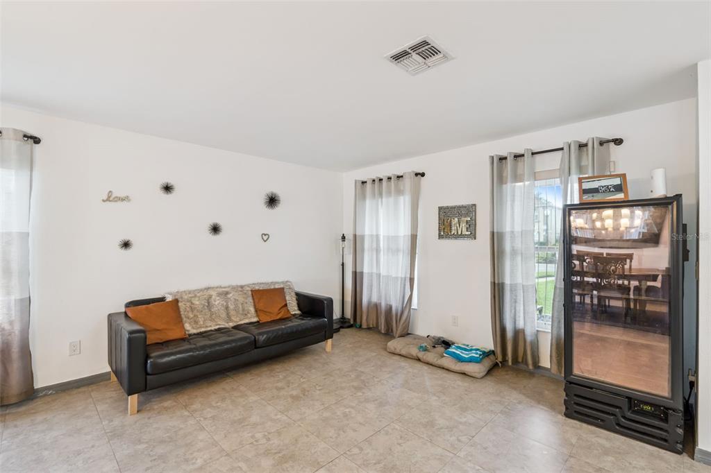 1411 Clarks Summit Court Orlando, FL 32828 - Photo 12 of 50 a living room with furniture and a walk in closet