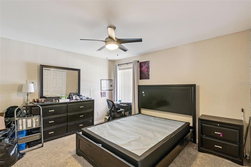 1411 Clarks Summit Court Orlando, FL 32828 - Photo 21 of 50 a living room with hard wood floors and a flat screen tv