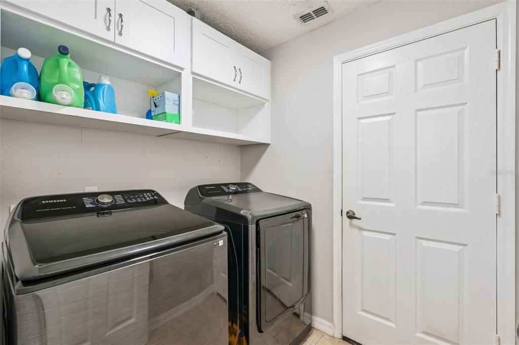1411 Clarks Summit Court Orlando, FL 32828 - Photo 27 of 50 a utility room with dryer and washer