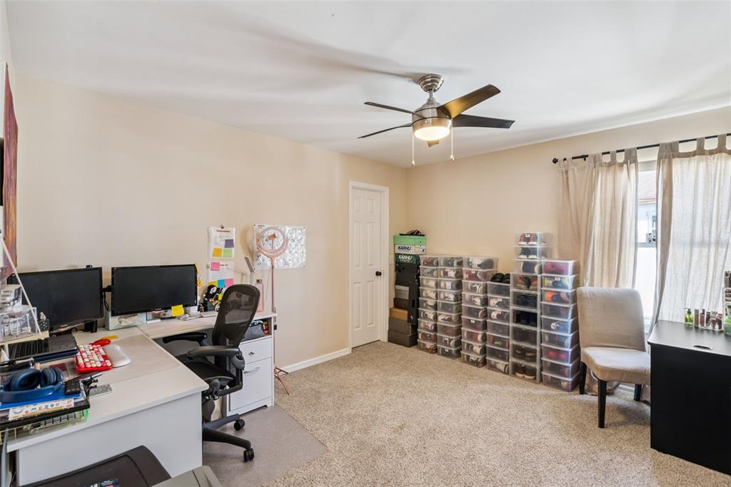 1411 Clarks Summit Court Orlando, FL 32828 - Photo 28 of 50 a view of a workspace with furniture and a window