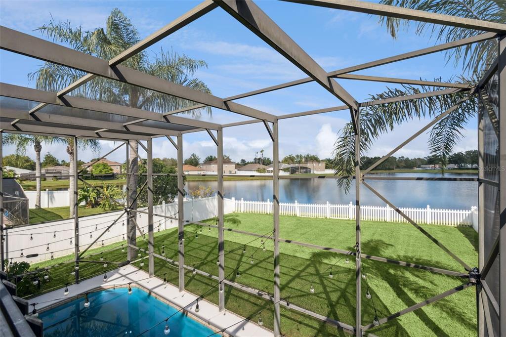 1411 Clarks Summit Court Orlando, FL 32828 - Photo 32 of 50 a view of a swimming pool with a patio