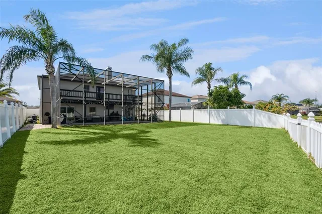a view of a lake with houses in the background