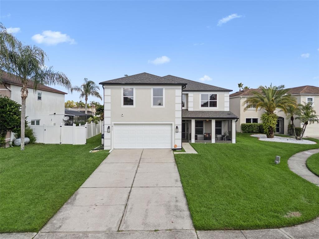 1411 Clarks Summit Court Orlando, FL 32828 - Photo 39 of 50 a front view of a house with a yard