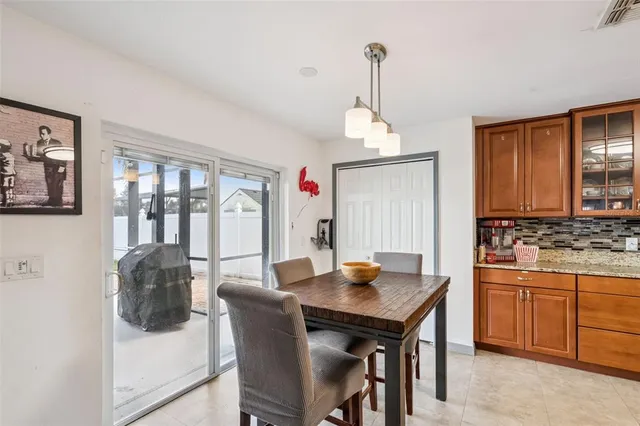 a view of a dining room with furniture and window
