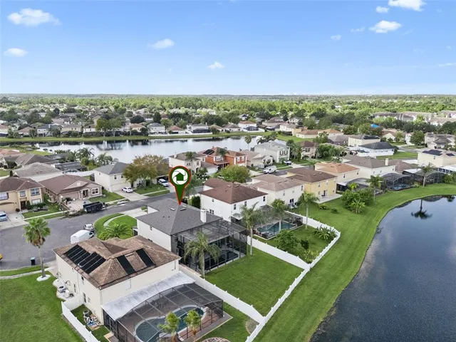 an aerial view of a house with a swimming pool