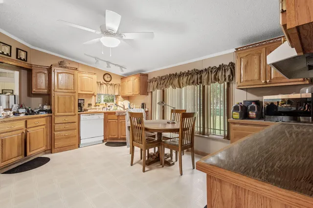 a view of a dining room with furniture and a livingroom