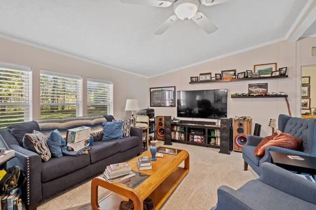 a living room with furniture and a large window