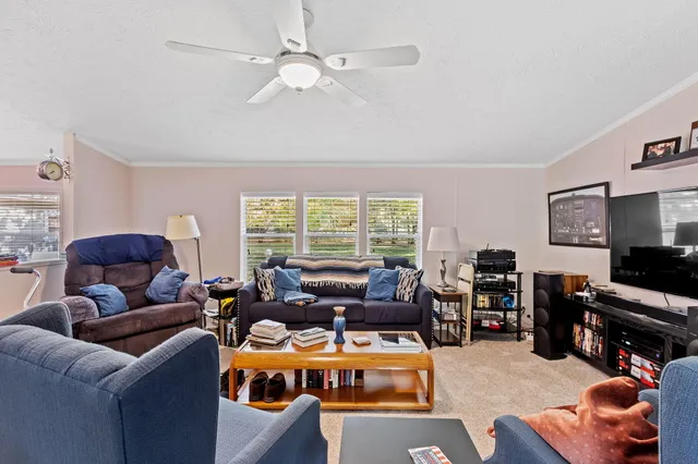 a bedroom with furniture and a chandelier