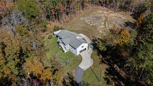 a aerial view of a house with a yard