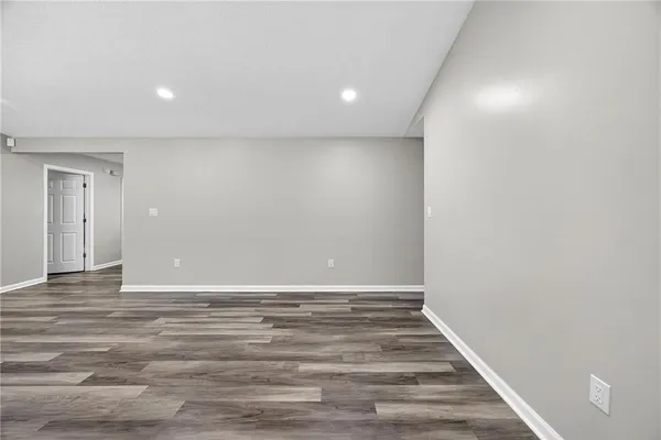 a view of room with wooden floor