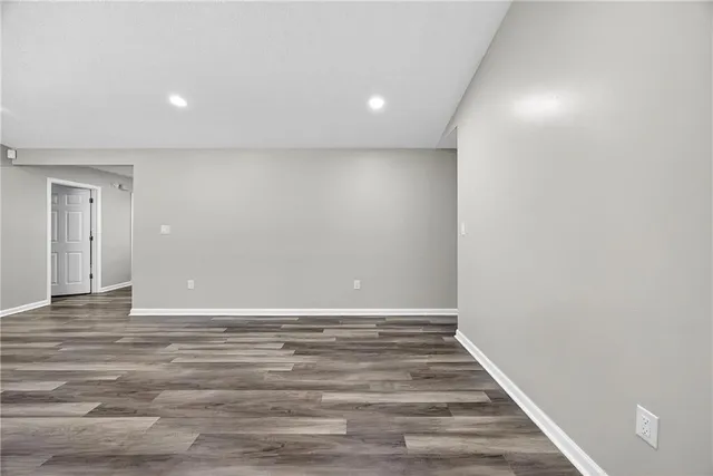 a view of room with wooden floor
