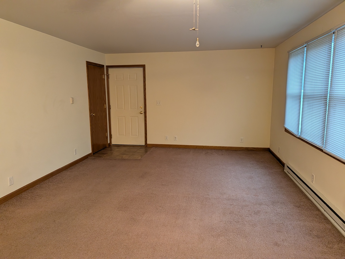 234 South Emmett Street, Unit C Genoa, IL 60135 - Photo 3 of 6 an empty room with a empty space