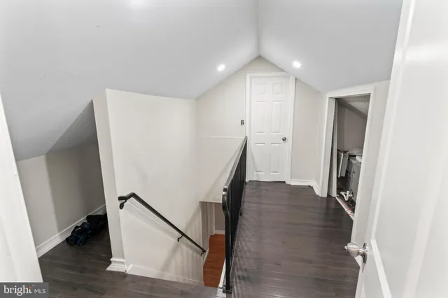 a view of entryway with wooden floor and stairs