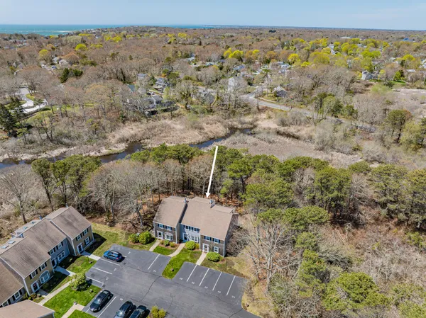 an aerial view of a house with a yard