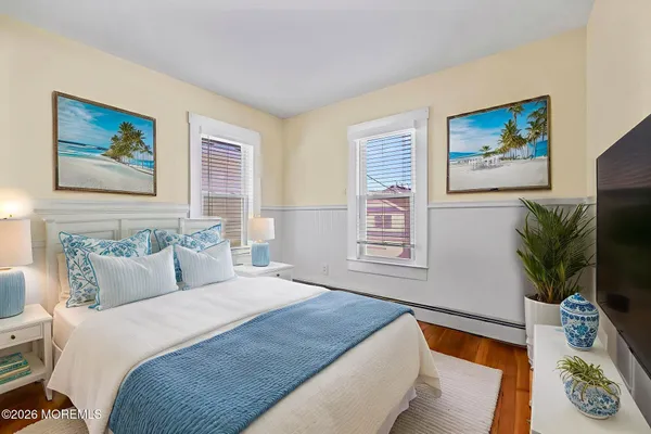 a bedroom with furniture and a potted plant