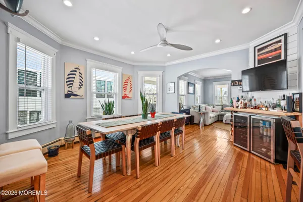 a view of a dining room with furniture window and wooden floor