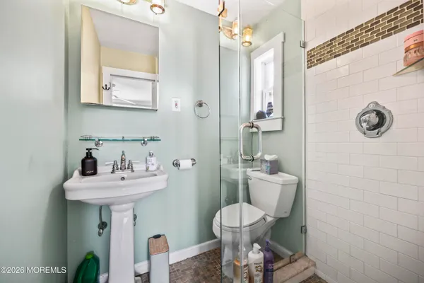 a bathroom with a sink and a shower