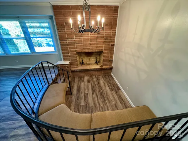 a view of a livingroom with furniture window and wooden floor