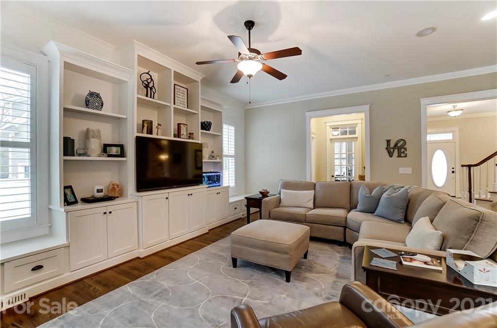 829 Elswick Court Fort Mill, SC 29708 - Photo 12 of 48 a living room with furniture a flat screen tv and a window