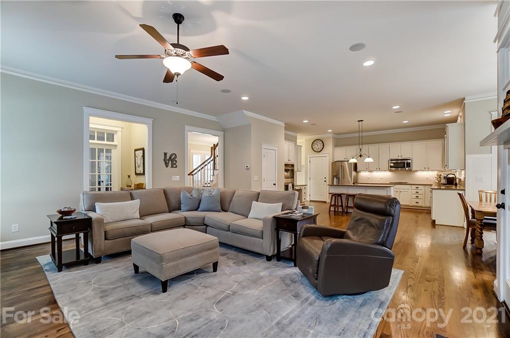 829 Elswick Court Fort Mill, SC 29708 - Photo 13 of 48 a living room with furniture kitchen view and a chandelier