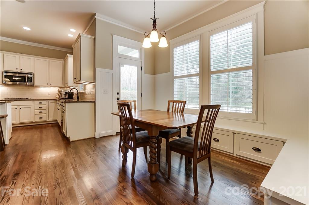 829 Elswick Court Fort Mill, SC 29708 - Photo 16 of 48 a view of a dining room with furniture window and wooden floor