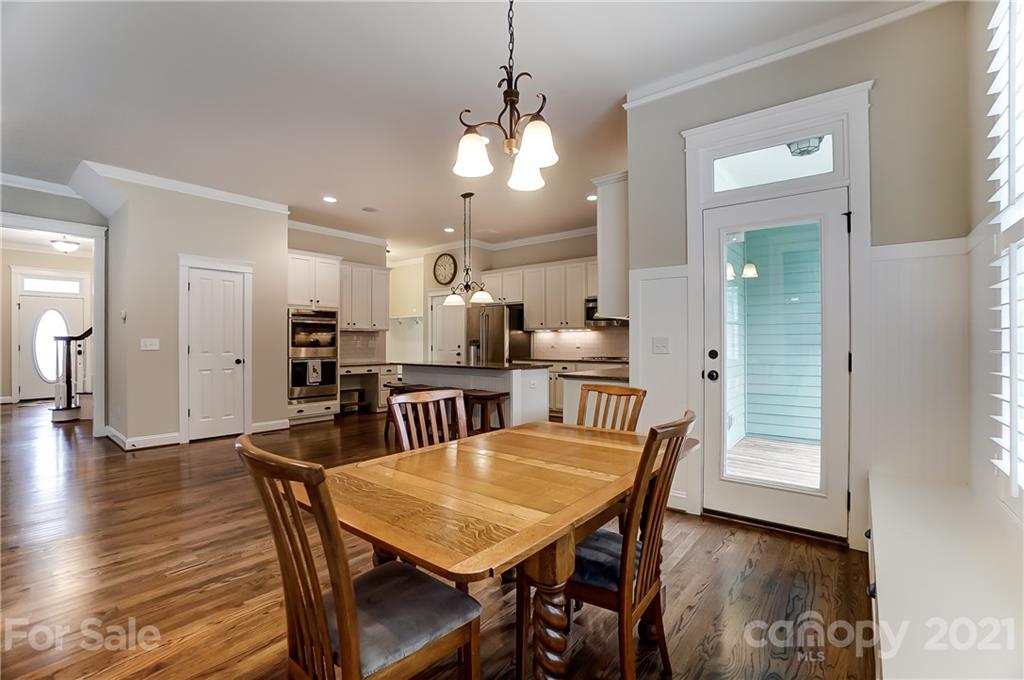 829 Elswick Court Fort Mill, SC 29708 - Photo 18 of 48 a dining room with furniture and wooden floor